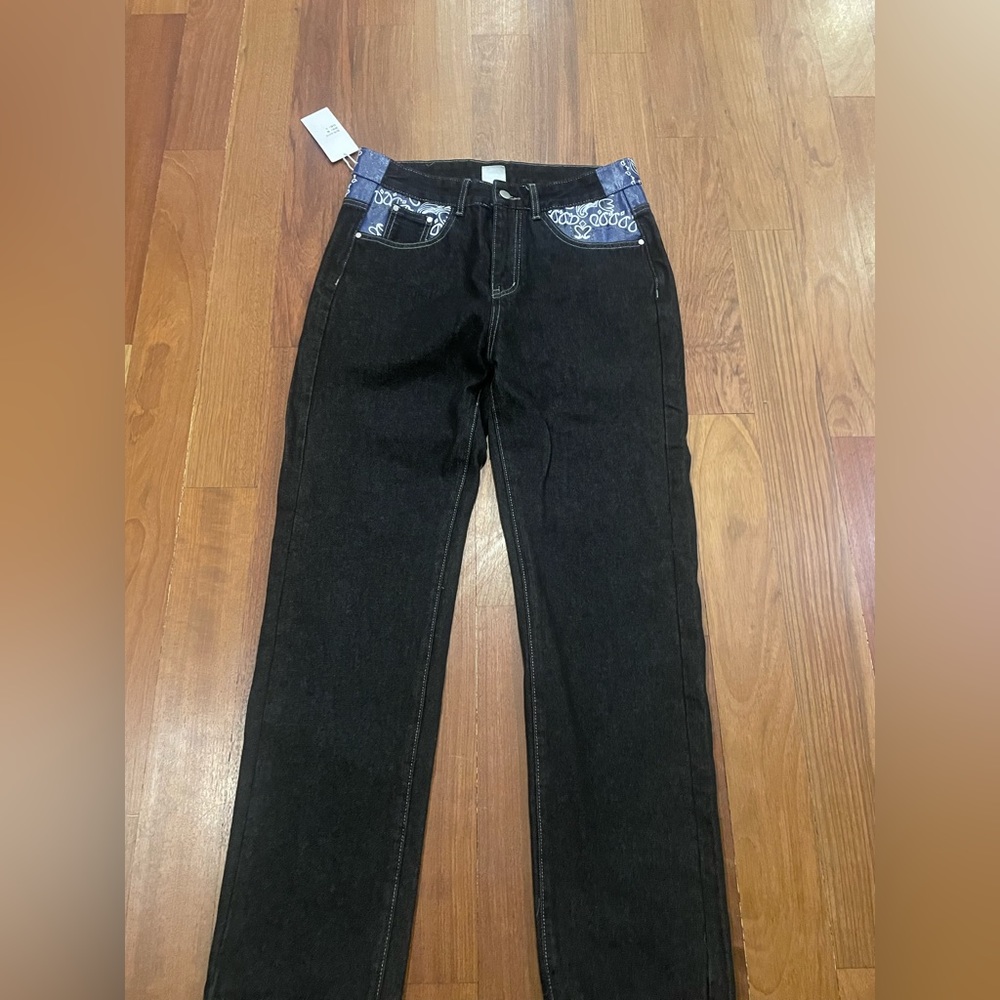 Long black jeans that have blue designs NOT USED